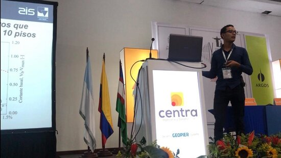 Gustavo A. Araújo R. presenting his MS thesis research on seismic risk in thin lightly reinforced concrete wall buildings